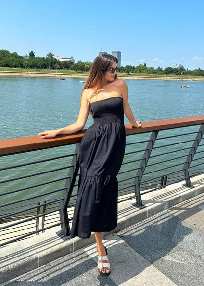 Crna Haljina Uma bez rukava od laganog pamuka s elastičnim gornjim dijelom i volanom, elegantna do gležnja