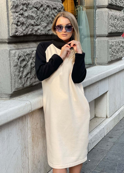 Haljina Mirna bež midi haljina s crnim raglan rukavima i kratkim rajfešlusom na ovratniku